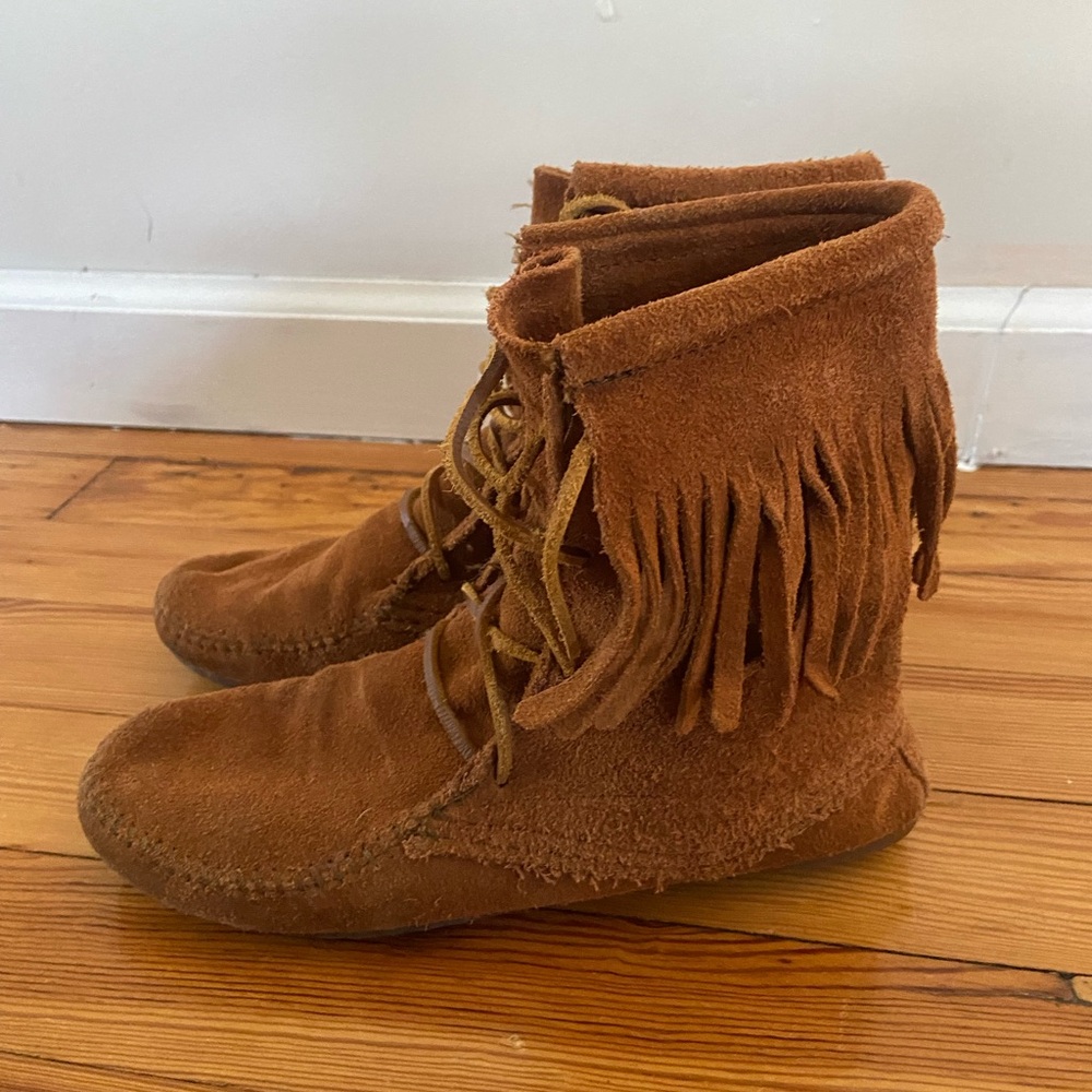 Minnetonka boots. Stylish and comfy with cute fringes.